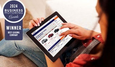 Woman on tablet device looking at Nationwide Vehicle Contracts website