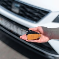 a person holding a key in their hand