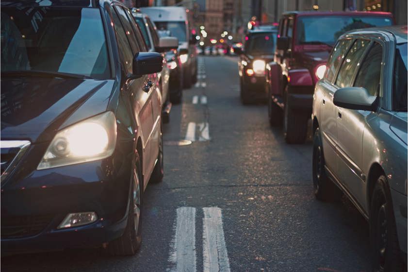 Cars stuck in traffic in a busy city