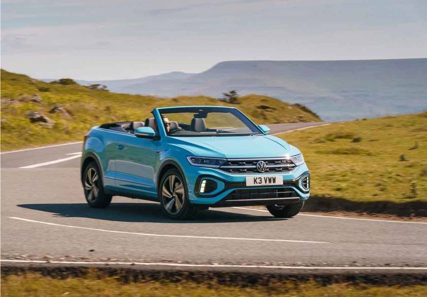 Volkswagen T-Roc Cabriolet in blue driving on the road