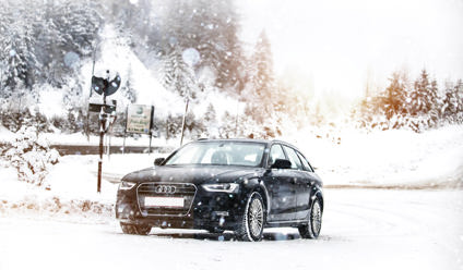 Car driving on a very snowy road