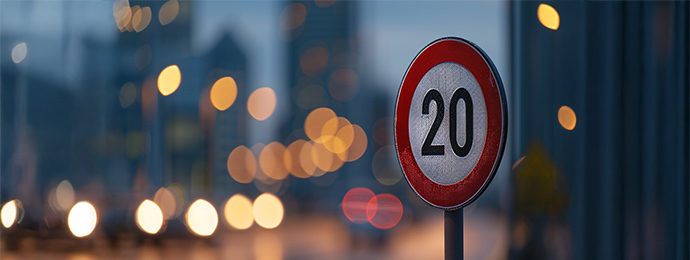 Photorealistic close-up of a UK 20mph speed limit sign