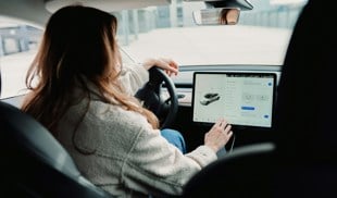 woman driving tesla