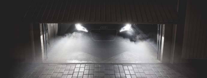 car leaving its garage in foggy weather
