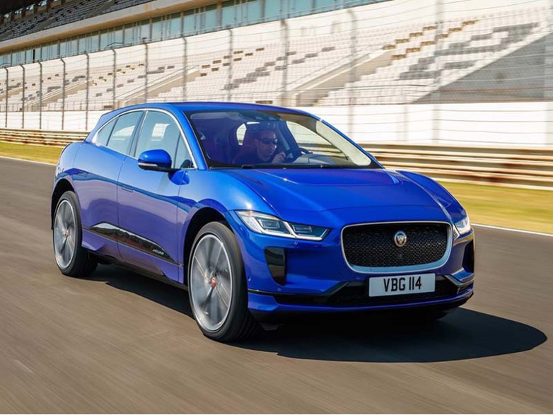 blue jaguar i-pace driving on a race track