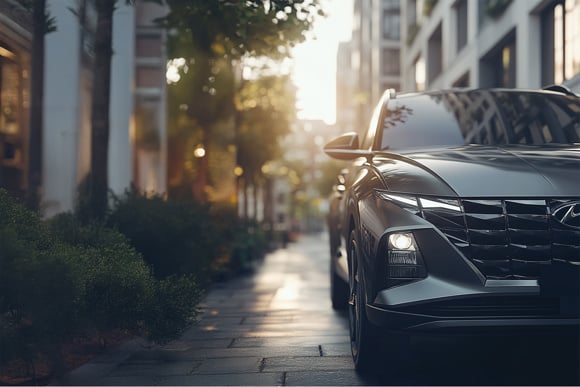 Modern Korean SUV with Sleek Design on an Urban Street at Sunset