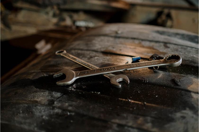 Spanners sitting on top of a black toolbox