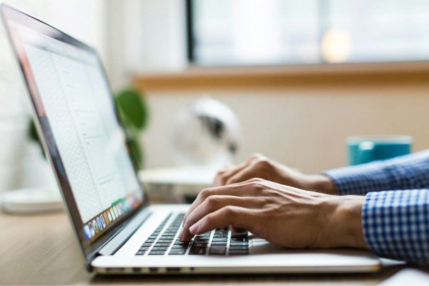 person typing on computer