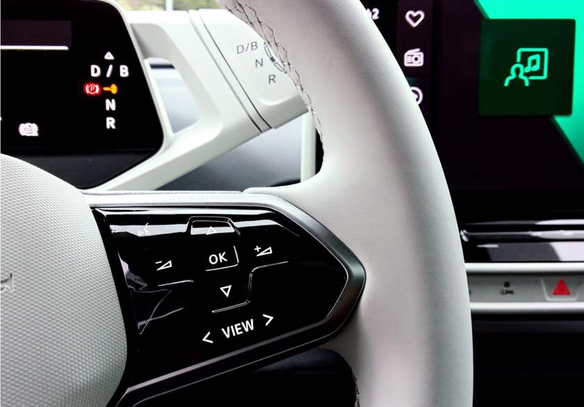 Car steering wheel in white with hands-free controls