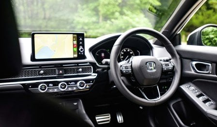 Honda lease car with infotainment system connected to Apple CarPlay