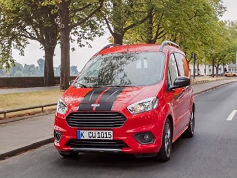 red ford transit courier with black racing stripes