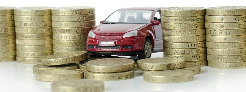 Toy car surrounded by coins