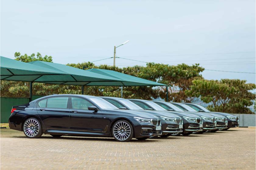 BMWs lined up in a car park