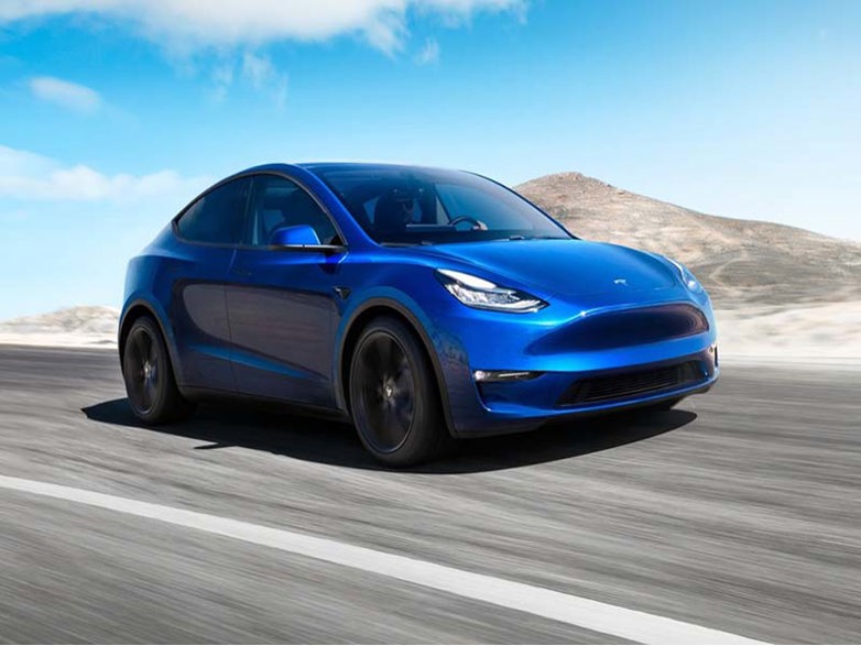 Tesla Model Y on an arid road