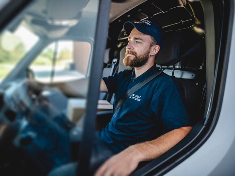 delivery driver sat in van