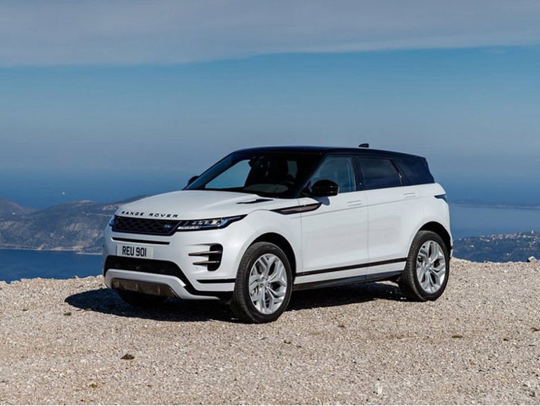 white range rover evoque on mountain road