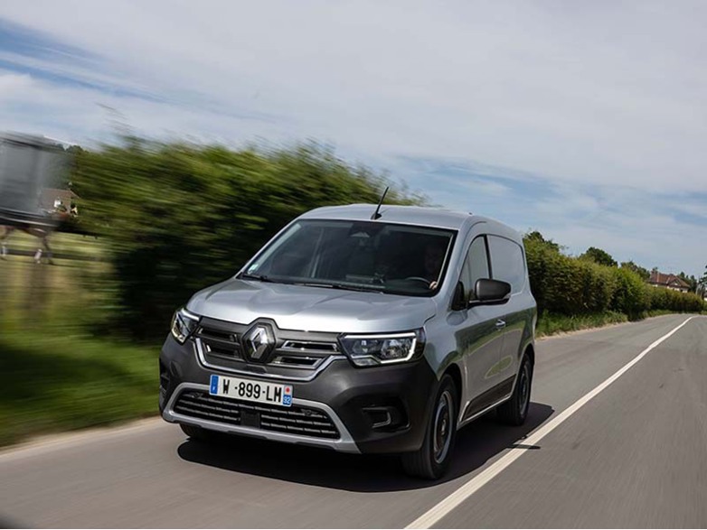 silver renault kangoo driving on a country lane