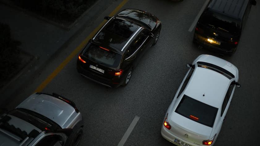 Black and white cars in traffic