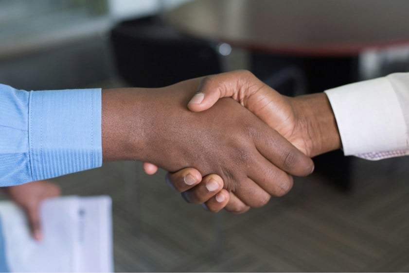 two people shaking hands