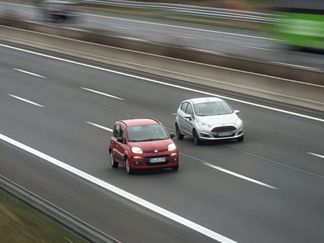 Cars driving next to each other on a motorway