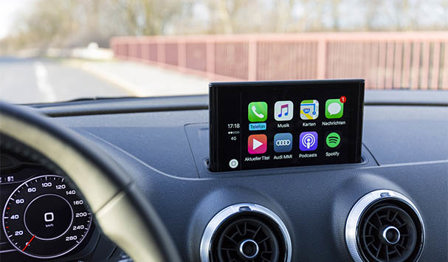 Close up of a car's dashboard with touchscreen. 