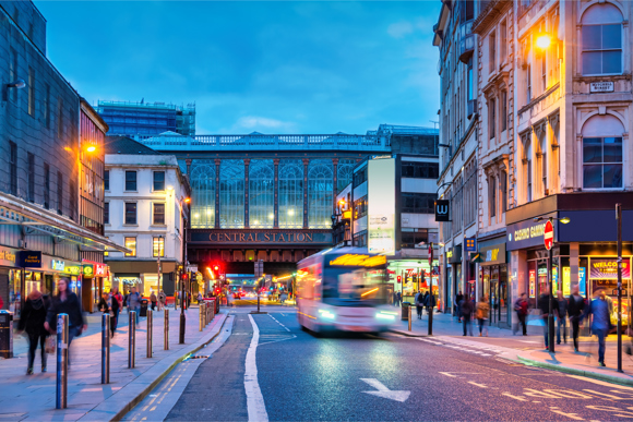 Argyle Street and Glasgow Central Station in downtown Glasgow, Scotland at night.