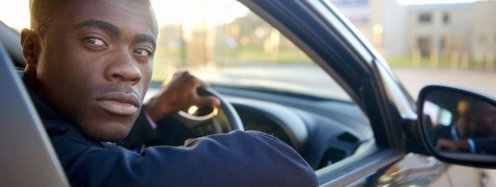 young man reversing car