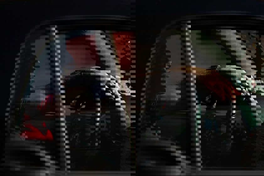 Person sitting in vehicle at night