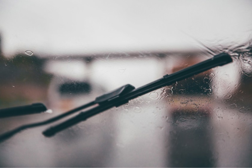 Windscreen wipers in use on a rainy day