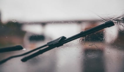 Windscreen wipers in use on a rainy day