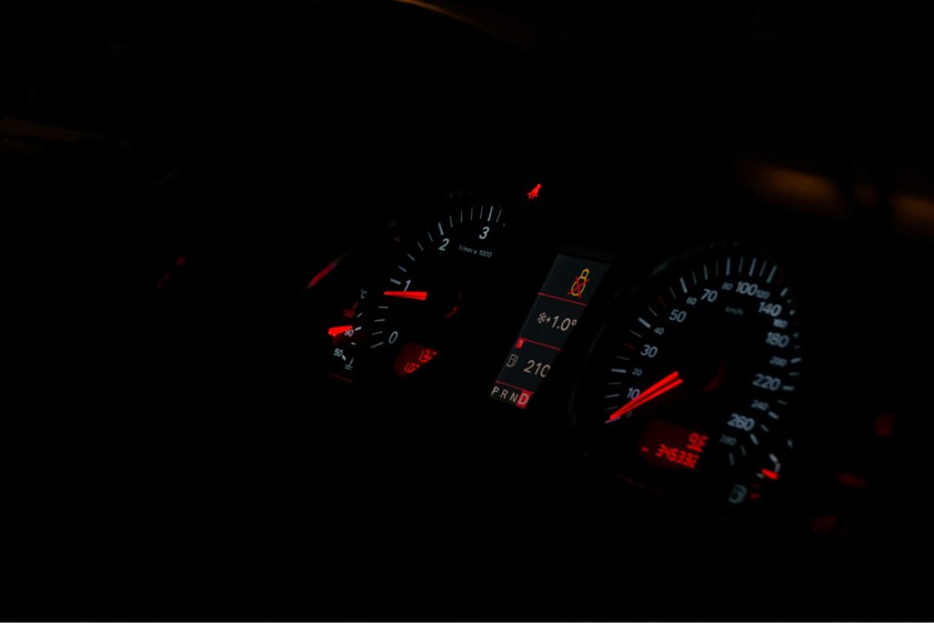 Car instrument panel with red lights