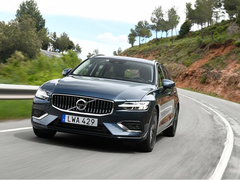 black volvo v60 driving on the road