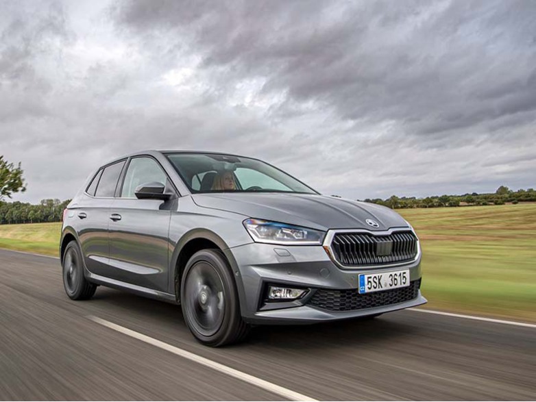 grey skoda fabia hatchback driving on the road