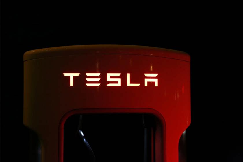 Tesla charger lit up in the dark