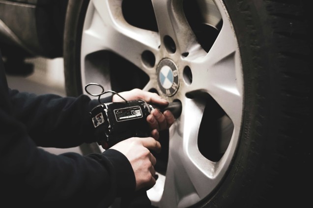man refitting a tyre