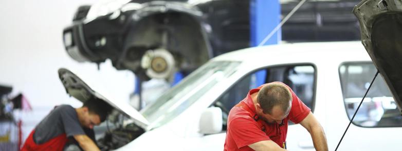 man servicing a van