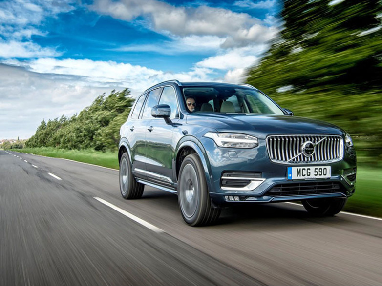 volvo xc90 driving on the road