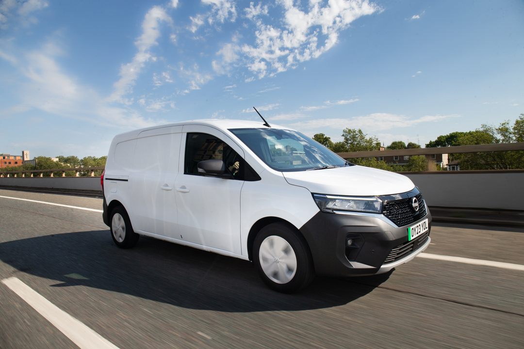 Nissan Townstar in white driving on the road