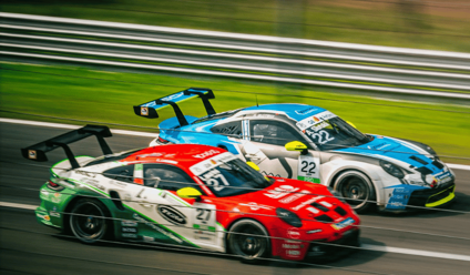 Two race cars racing on a track