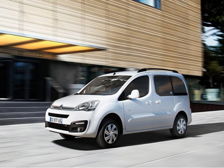 white citroen e-berlingo driving