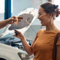 Shot of a woman receiving her car keys