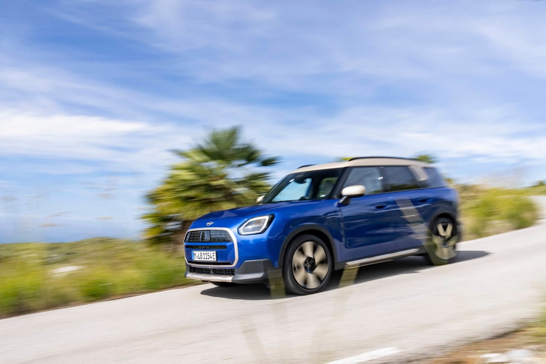 Mini Countryman Electric in blue driving on the road