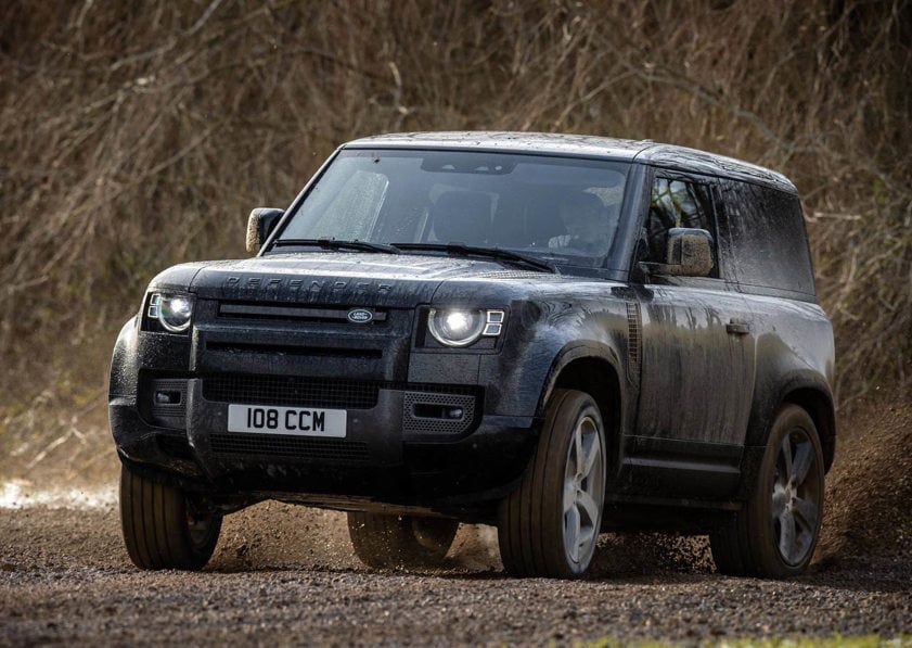 Black Land Rover Defender driving off road