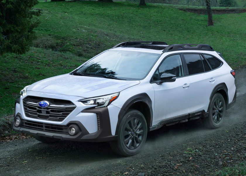 Subaru Outback in white driving