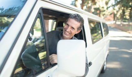 Man driving white van