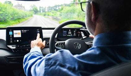 Man using infotainment system in a Volkswagen lease car