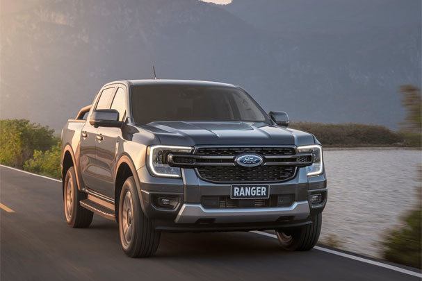 Black Ford Ranger 2023 driving on the road 