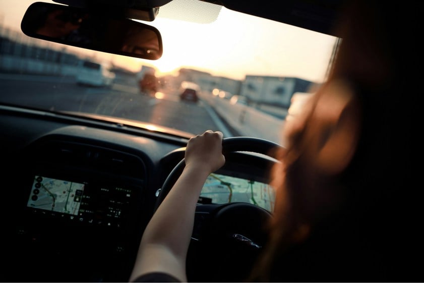 woman driving on the road