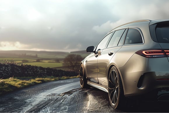 Luxury Estate Car Driving Through Scenic Countryside Roads