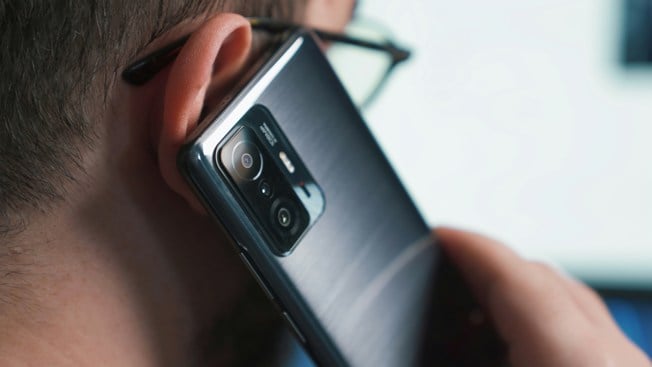 a close-up of a person talking on a cell phone
